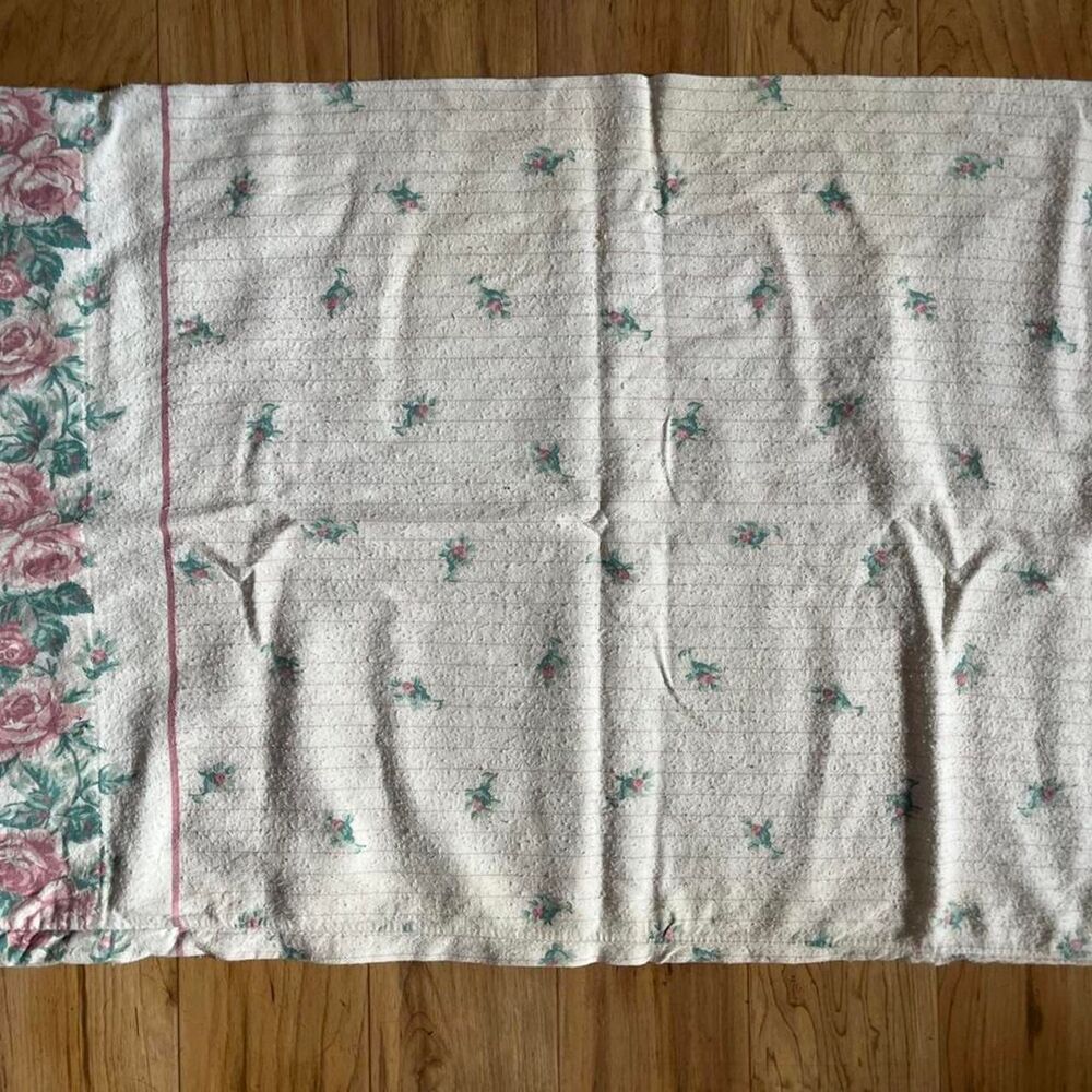 Floral vintage quilt with pink and green accents